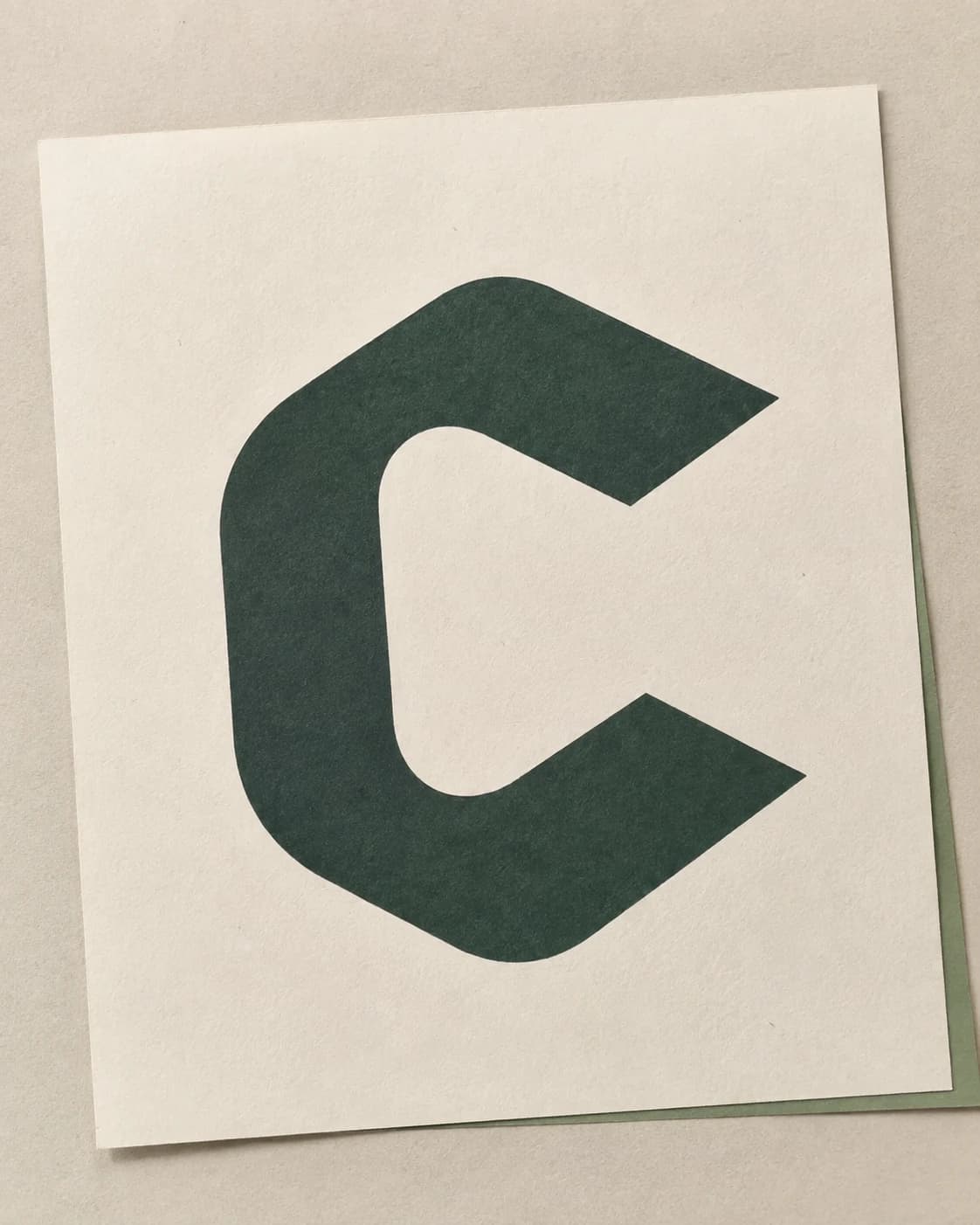A print study of the open Congar C in forest-green ink on textured cream paper.